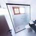 Pouso Sambaquis bathroom in Ilhabela with glass shower, toilet, and black vanity