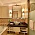 Zhong'an Huana Holiday Hotel in Hangzhou bathroom with bathtub, vessel sink, large mirror and glass shower