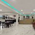 Knights Inn Belton/Temple lobby with seating area, front desk, and marble tile flooring in Belton