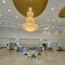 Xinji Garden Hotel in Nanchang lobby with grand chandelier, polished tile floor, and front desk