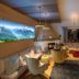 Biohotel Rastbichlhof lounge with panoramic mountain wall art and circular seating in Neustift im Stubaital