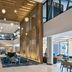 Delta Hotels by Marriott Ashland Downtown lobby with tall wood slat feature wall and hanging globe lights