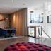Go Hotel Østerport in Copenhagen dining area with blue chairs and pendant lights beside a lobby staircase