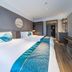 Fairyland Hotel - Kunming Nanping Pedestrian Street Store guest room with two beds and wall-mounted TV