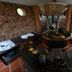 Some Days Of Silence Resort And Spa in Dong Hai, rustic spa room with round wooden soaking tub and brick walls