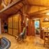 Copper Creek Inn, Cabins and Lodge in Ashford: rustic cabin interior with large window and forest view