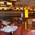 Iris Orchard All Suites Hotel (Tangshan Convention Center) restaurant in Tangshan with round tables and curved seating