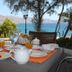 Outdoor breakfast table at Karystion Hotel in Kárystos with sea and mountain views