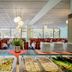Hotel Behounek in Jáchymov buffet dining room with trays of salad, sandwiches and stacked plates