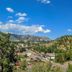 The Historic Crags Lodge in Estes Park with mountain and valley views under a blue sky