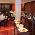 Hotel Estelar de La Feria Bogotá restaurant with set tables and buffet dishes