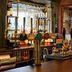The White Horse in Dorking bar counter with beer taps and hanging wine glasses