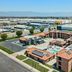 Days Inn by Wyndham Fontana / Rialto in Rialto, aerial view with outdoor pool and parking lot