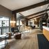 Gravity Haus Steamboat lobby with lounge seating, front desk and mountain-view windows in Steamboat Springs