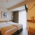 Hotel Zaragoza Plaza in San Sebastian guest room with twin beds and balcony door