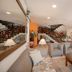 Ilha Flat Hotel in Ilhabela lobby with seating area, staircase, and front desk