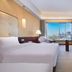 Lihua Grand Hotel Taiyuan guest room with twin beds and city skyline view