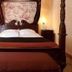Hostellerie Les Hauts De Sainte Maure guest room with four-poster bed in Sainte-Maure-de-Touraine