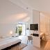 Bij Jef Den Hoorn guest room with twin beds, desk, bathtub and balcony door