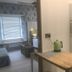 The Railway Inn in Brixham: compact room with kitchenette, microwave, kettle, and a bed by a window