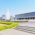 Hiroshima Ekimae Green Hotel in Hiroshima with fountain, landscaped garden, and modern exterior