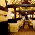 Marygreen Manor Hotel in Brentwood dining room with set tables, carved wood beams and chandeliers