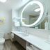 Hampton Inn & Suites Raleigh-Durham Airport-Brier Creek bathroom with walk-in shower, vanity, and lit mirror