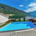 Hofslund Fjord Hotel in Sogndal with outdoor pool and fjord and mountain views
