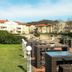 City Hotel Dresden Radebeul in Radebeul with a terrace and outdoor seating overlooking buildings and lawn