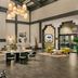 Hilton Scottsdale Resort & Villas lobby with high ceilings, fireplace, seating areas and chandeliers in Scottsdale