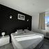 Hôtel Le Néron - Logis guest room with bed and mountain view in Fontanil-Cornillon