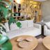 Canal Aigues Mortes lounge in Aigues-Mortes with white sofas, round coffee tables and shelving