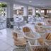 Hotel Sorra Daurada Splash in Malgrat de Mar outdoor dining area with white tables and wicker chairs
