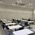 Toyoko Inn Tobu Utsunomiya eki Nishi guchi meeting room with white tables and navy chairs in Utsunomiya