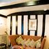 Marygreen Manor Hotel in Brentwood: cozy lounge with patterned sofa, coffee table, and exposed black beams