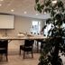 Logis -Hotel & Restaurant De La Place in Seulline meeting room with projector screen and conference table