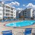 Club Wyndham Nashville outdoor pool with blue lounge chairs and apartment-style buildings in Nashville