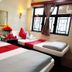 Day And Night Hotel - Hostel, Hong Kong: twin beds with red accents beside a window