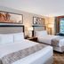 Cannery Casino Hotel, North Las Vegas guest room with two beds and large window drapes