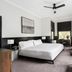 Gaige House in Glen Ellen guest room with king bed, desk, wall-mounted TV, and seating by the window