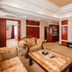 Grand View International Hotel, Liaoyang suite with ornate seating, coffee table and wall-mounted TV