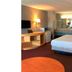 OYO Hotel Georgia Near Fairburn/Atlanta room in Union City with bed, TV, desk and vanity sink