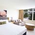 Silkari Mirage at Newport Sydney guest room with king bed, armchairs, and large window view