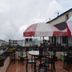Hotel Apple Valley in Kodaikanal terrace seating with mountain and town views under umbrellas