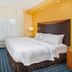 Fairfield Inn & Suites by Marriott Cookeville guest room with king bed, window, and seating area