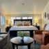 Mccall House Boutique Inn in Ashland guest room with king bed, seating area, and large windows