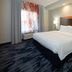 Fairfield Inn & Suites by Marriott Seattle Bremerton guest room with king bed, nightstands and window seating