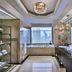Mandarin Oriental, Kuala Lumpur bathroom with double vanity, bathtub, and city skyline view