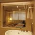 Rosedale Hotel Shenyang in Shenyang bathroom with a soaking tub and bedroom reflection