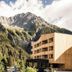 Falkensteiner Hotel Antholz in Rasun Anterselva/Rasen-Antholz with mountain views beside forest